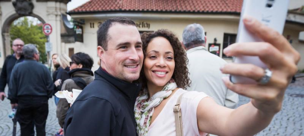 man and woman taking a selfie together on an incentive travel trip